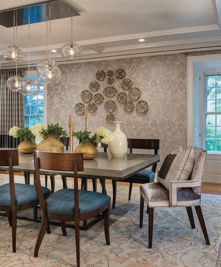 The formal dining room features some of the homeowner’s beloved antique dinnerware and Rubelli (rubelli. com) Venezia Gritti wall covering. PHOTOGRAPHED BY NAT REA